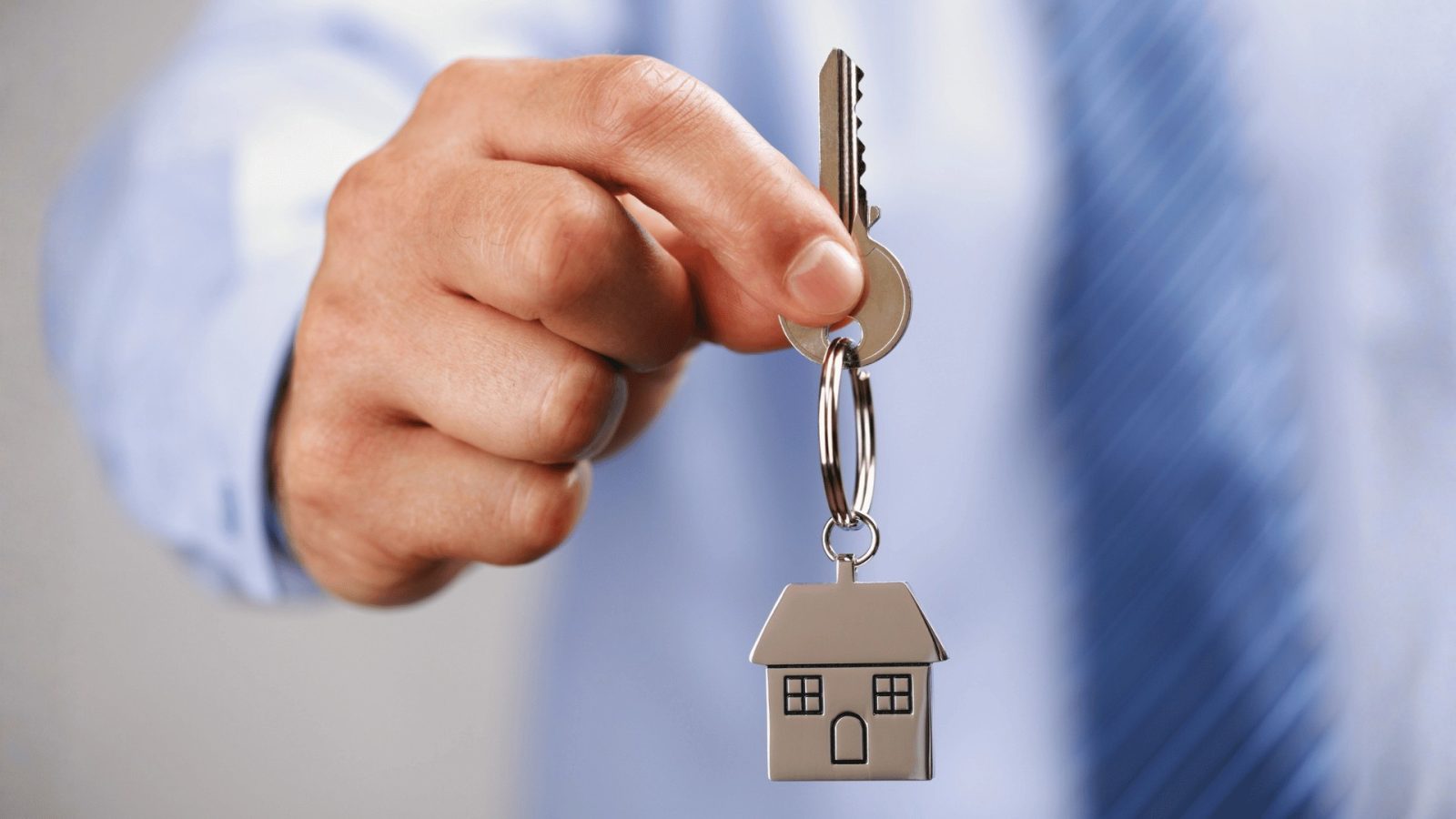 hand holding house keys
